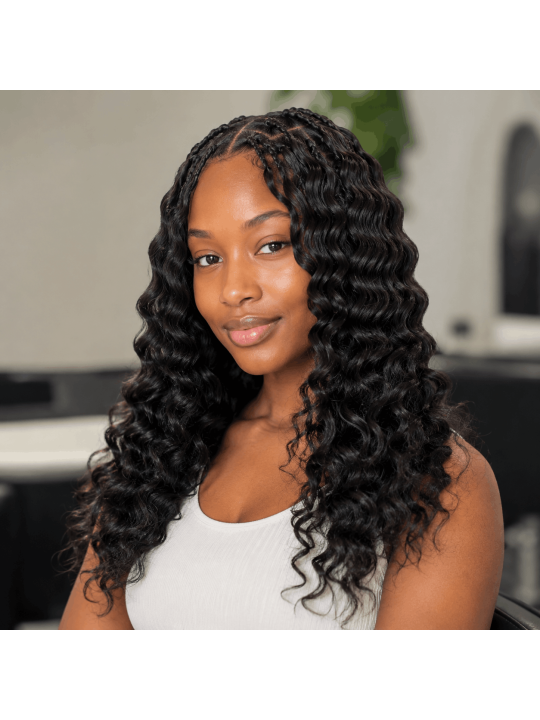 Extensions Crochet Deep Wave en cheveux naturels portées, résultat bouclé naturel avec volume souple et finition élégante.