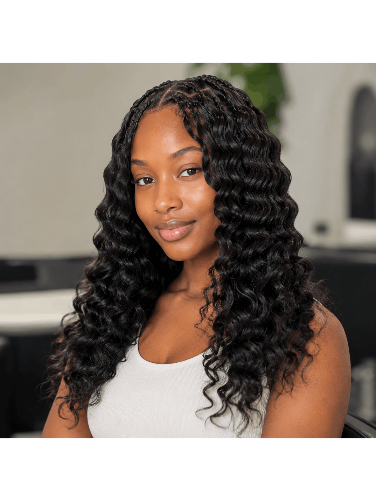 Extensions Crochet Deep Wave en cheveux naturels portées, résultat bouclé naturel avec volume souple et finition élégante.